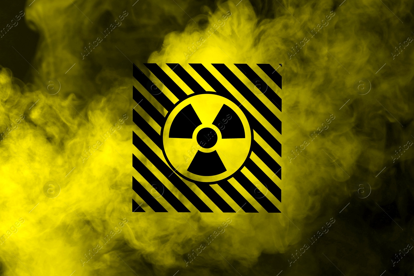 Radioactive sign and yellow toxic smoke against black background Image of Radioactive sign and yellow toxic smoke against black background