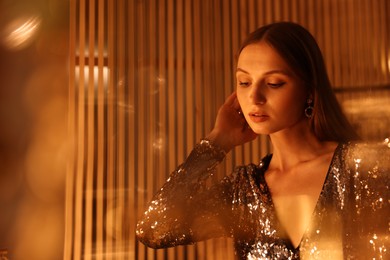 Photo of Beautiful woman getting ready indoors, space for text