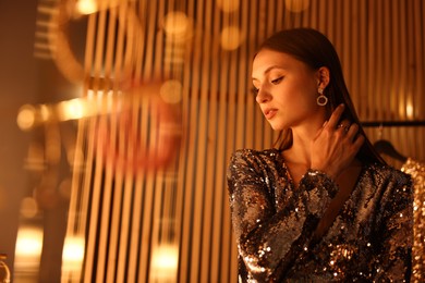 Photo of Beautiful woman getting ready indoors, low angle view