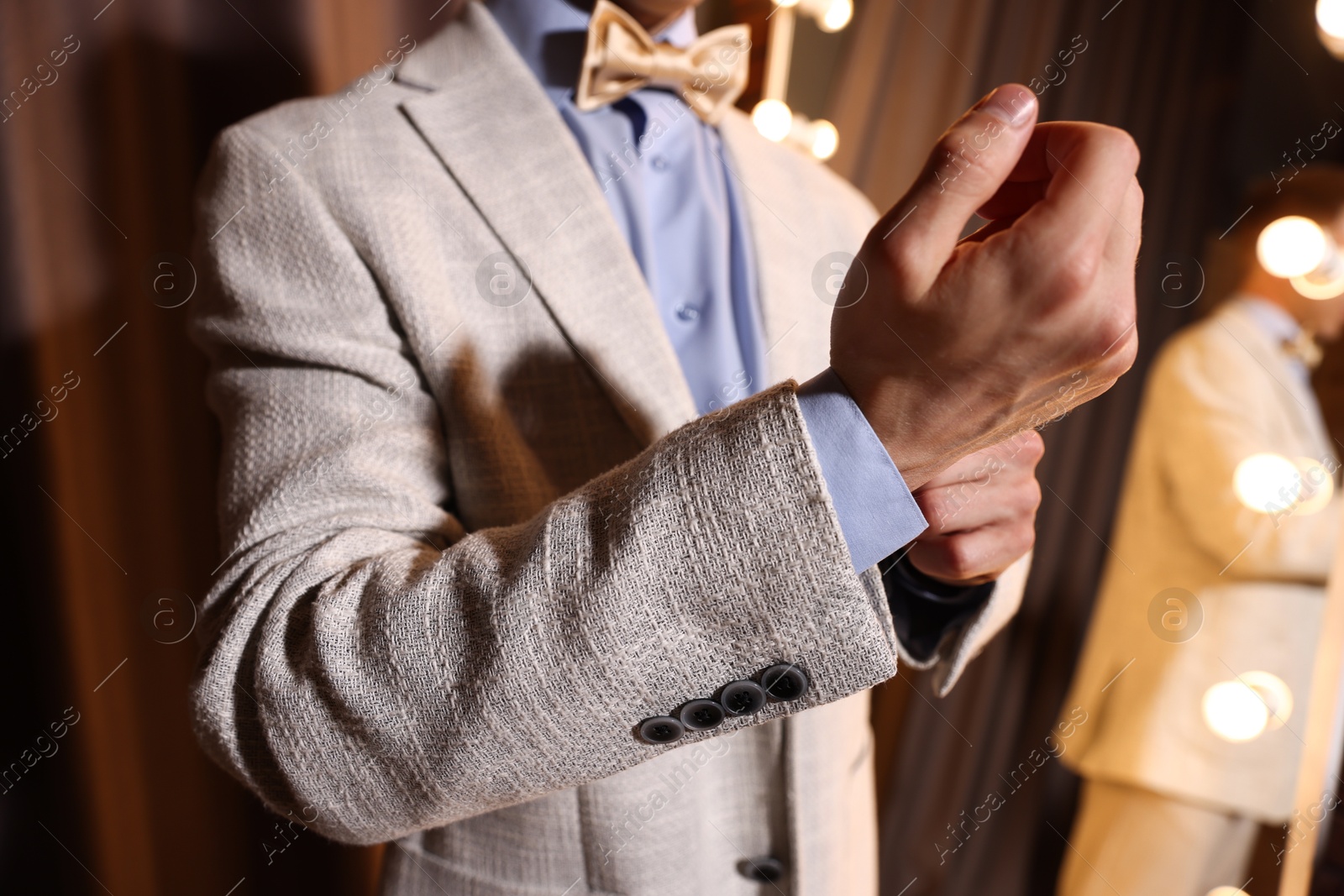 Man getting ready near mirror indoors, closeup Photo of Man getting ready near mirror indoors, closeup