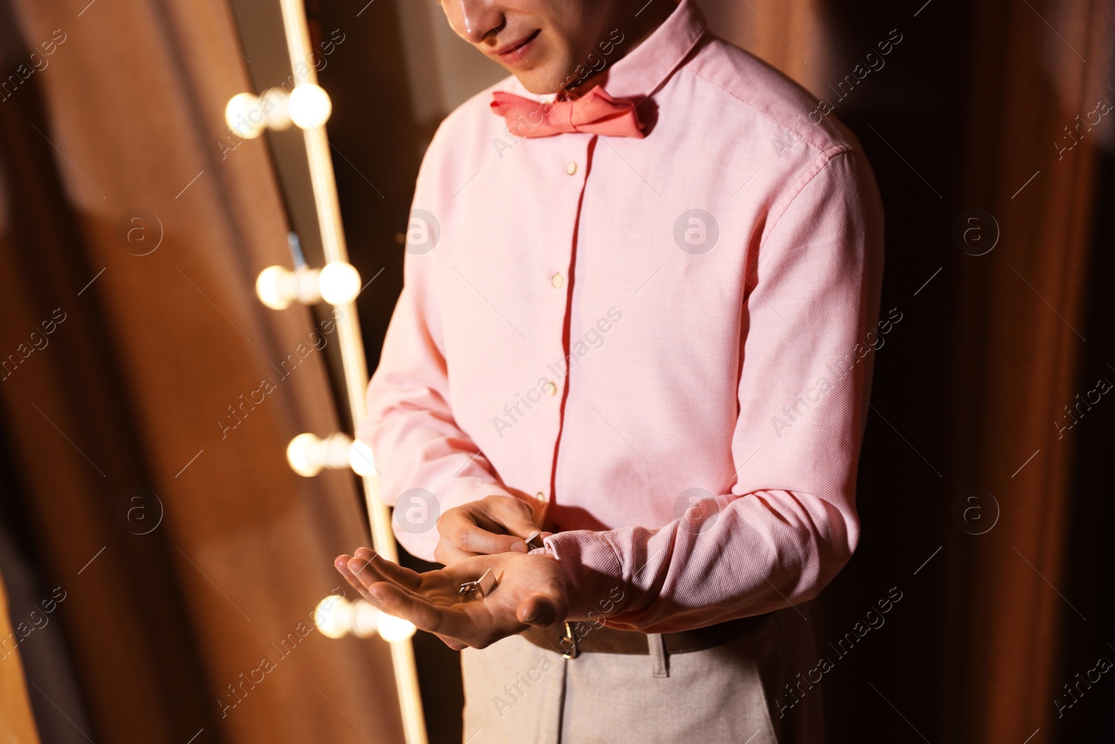 Man with cufflinks getting ready indoors, closeup Photo of Man with cufflinks getting ready indoors, closeup