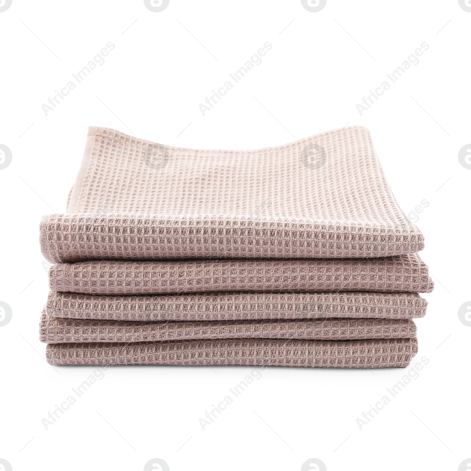 Photo of Clean stacked waffle towels isolated on white