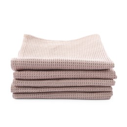 Photo of Clean stacked waffle towels isolated on white