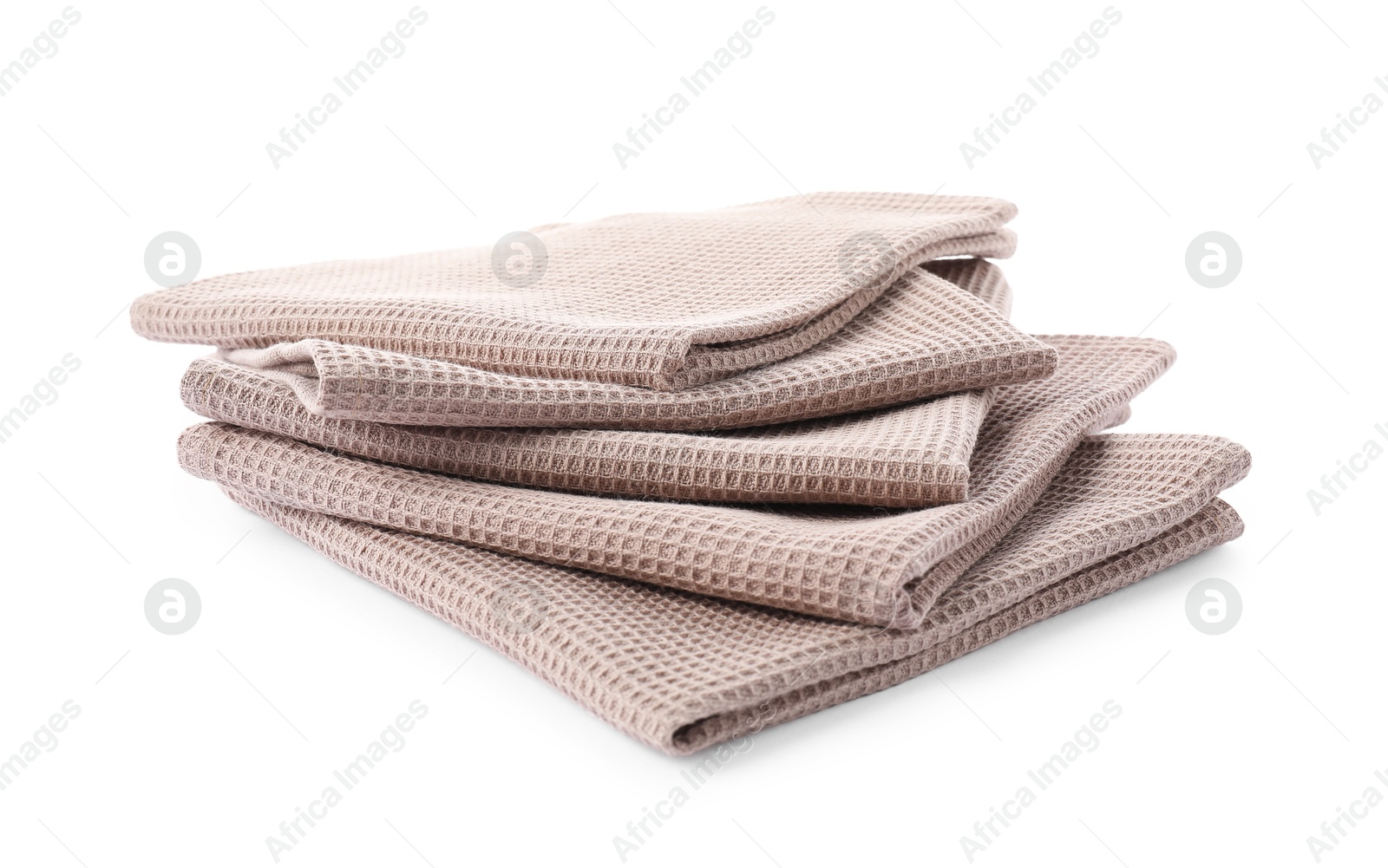 Photo of Clean stacked waffle towels isolated on white