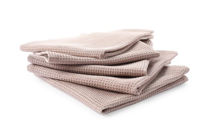 Photo of Clean stacked waffle towels isolated on white