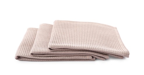 Photo of Clean stacked waffle towels isolated on white