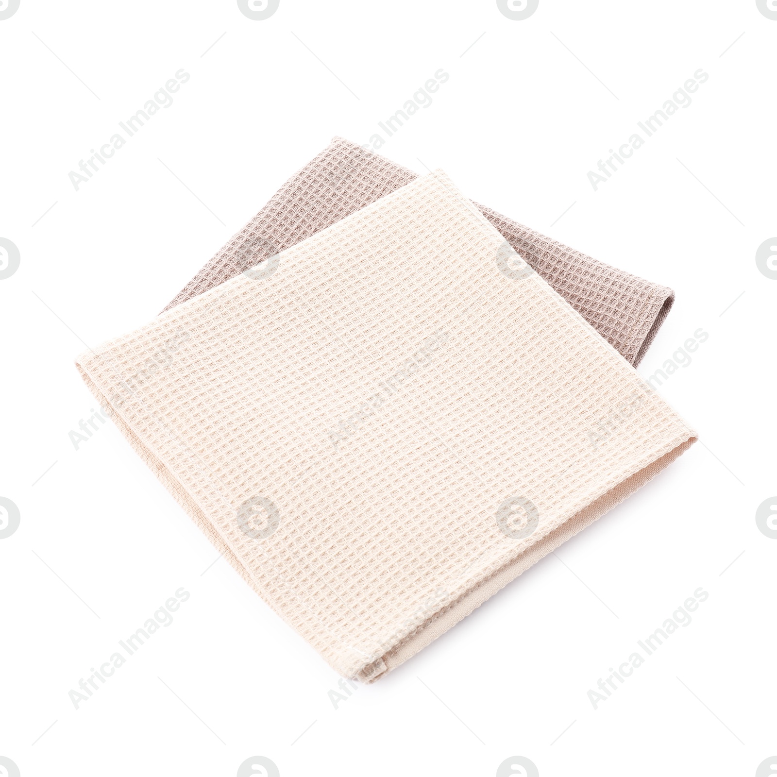 Photo of Clean stacked waffle towels isolated on white