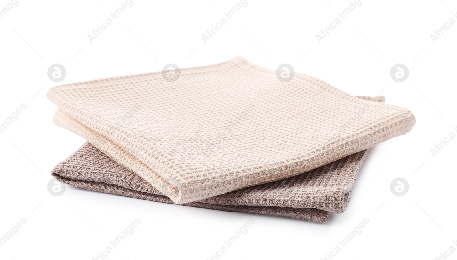Photo of Clean stacked waffle towels isolated on white
