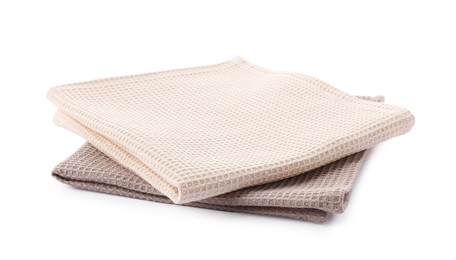 Photo of Clean stacked waffle towels isolated on white