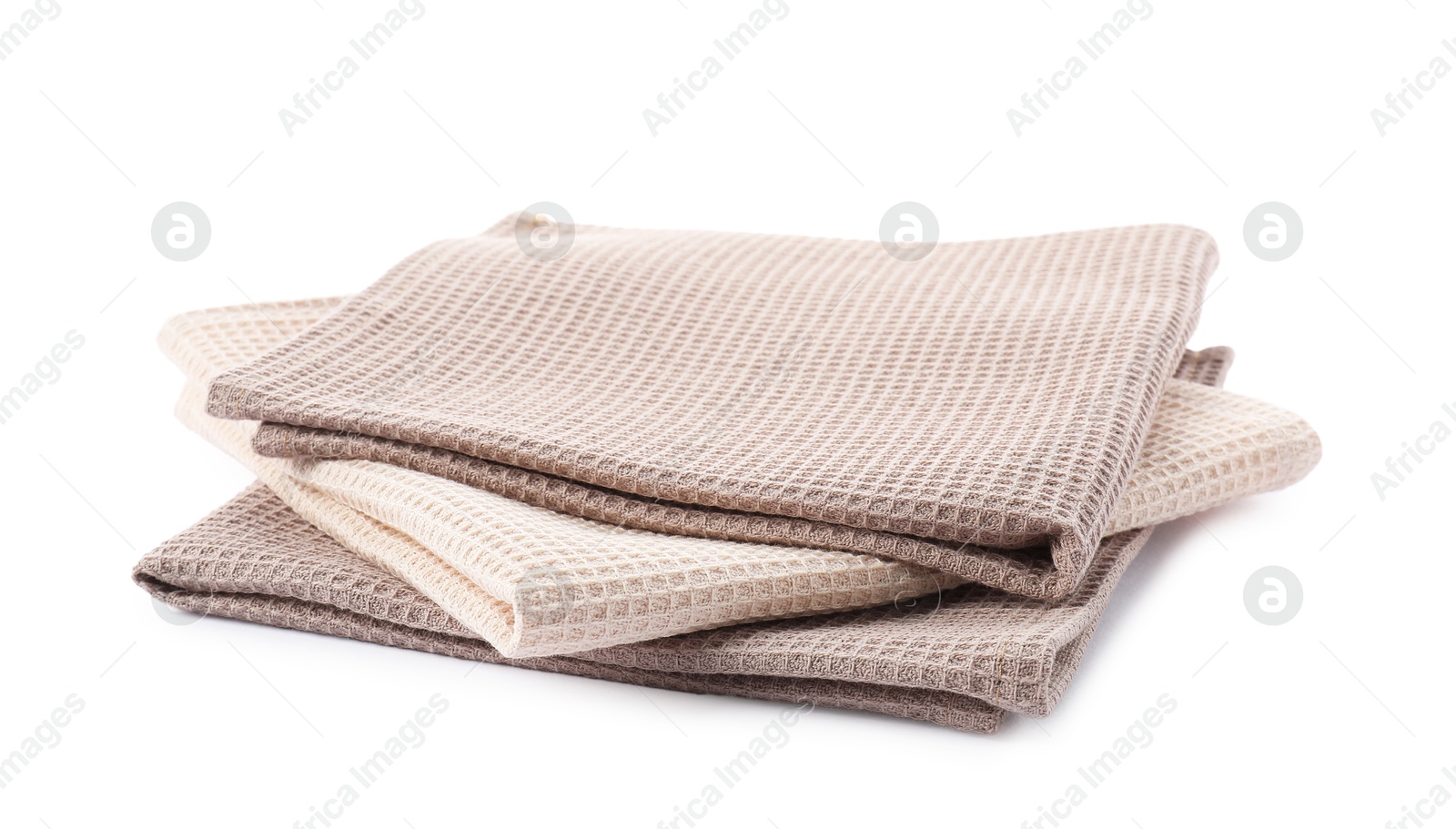 Photo of Clean stacked waffle towels isolated on white