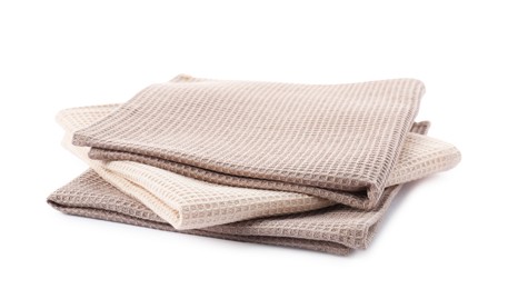 Photo of Clean stacked waffle towels isolated on white