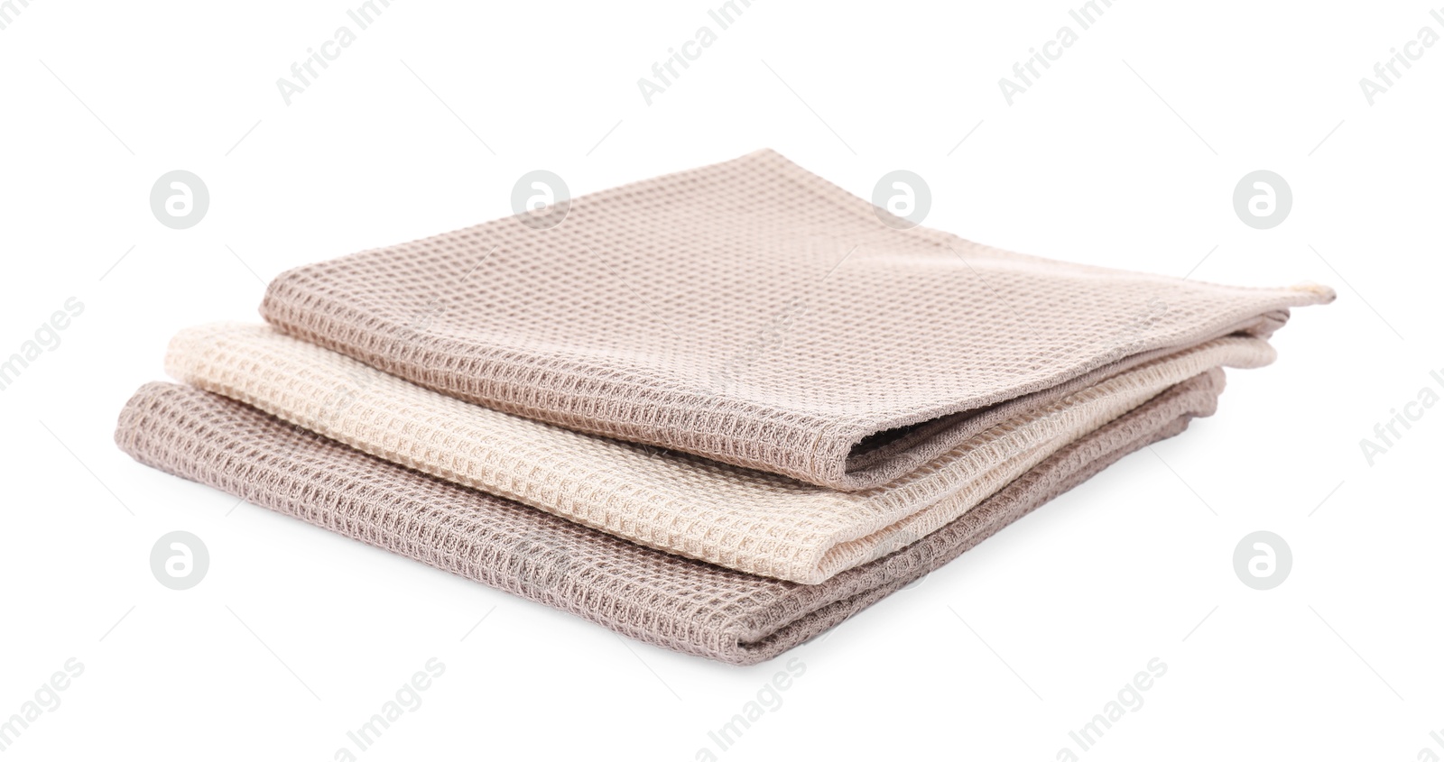 Photo of Clean stacked waffle towels isolated on white