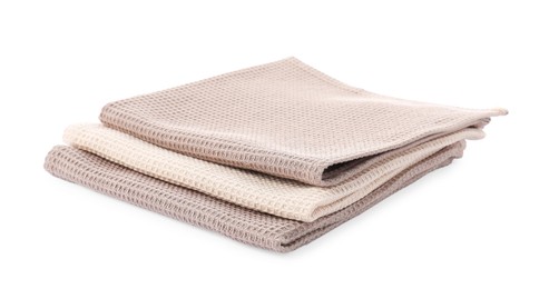 Photo of Clean stacked waffle towels isolated on white
