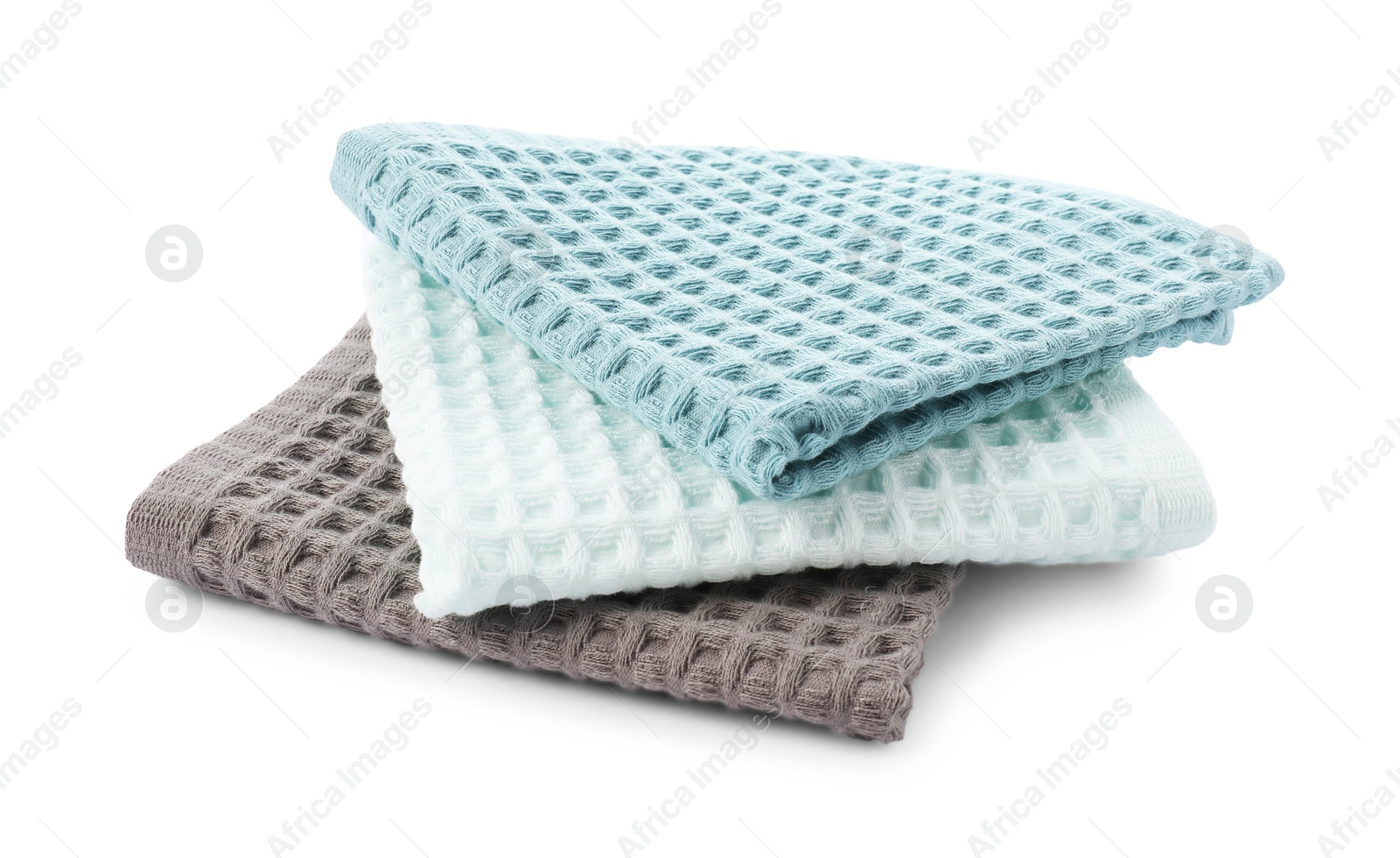 Photo of Clean colorful waffle towels isolated on white