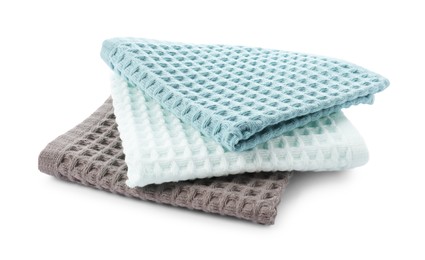 Photo of Clean colorful waffle towels isolated on white