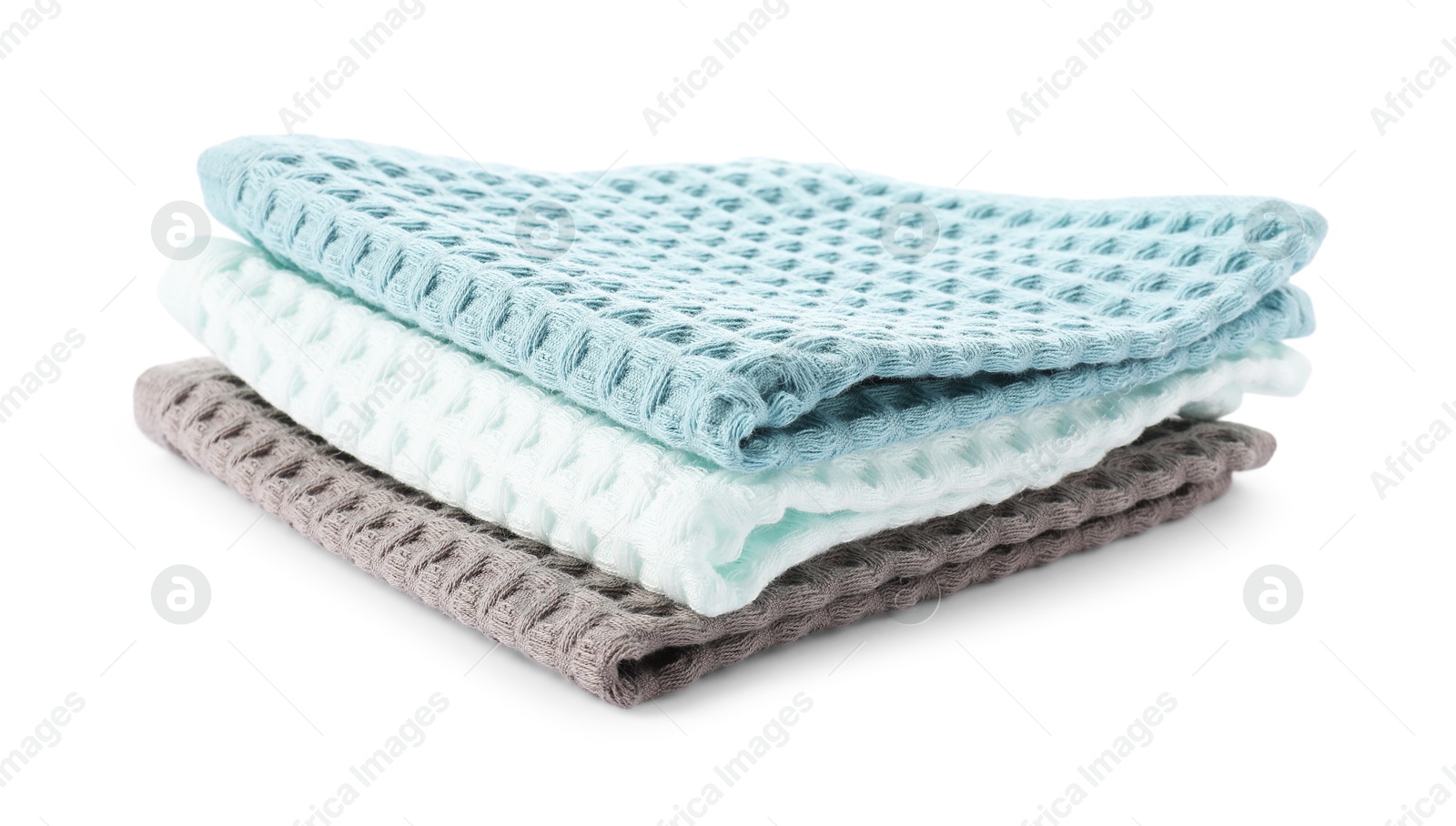 Photo of Clean colorful waffle towels isolated on white
