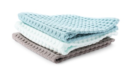 Photo of Clean colorful waffle towels isolated on white