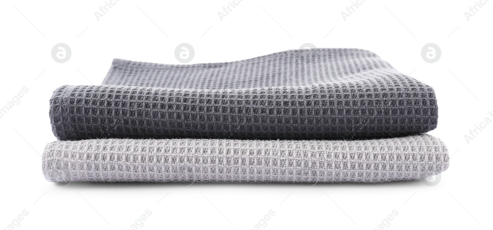 Photo of Clean stacked waffle towels isolated on white