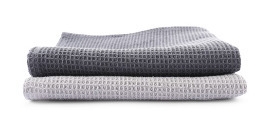 Photo of Clean stacked waffle towels isolated on white