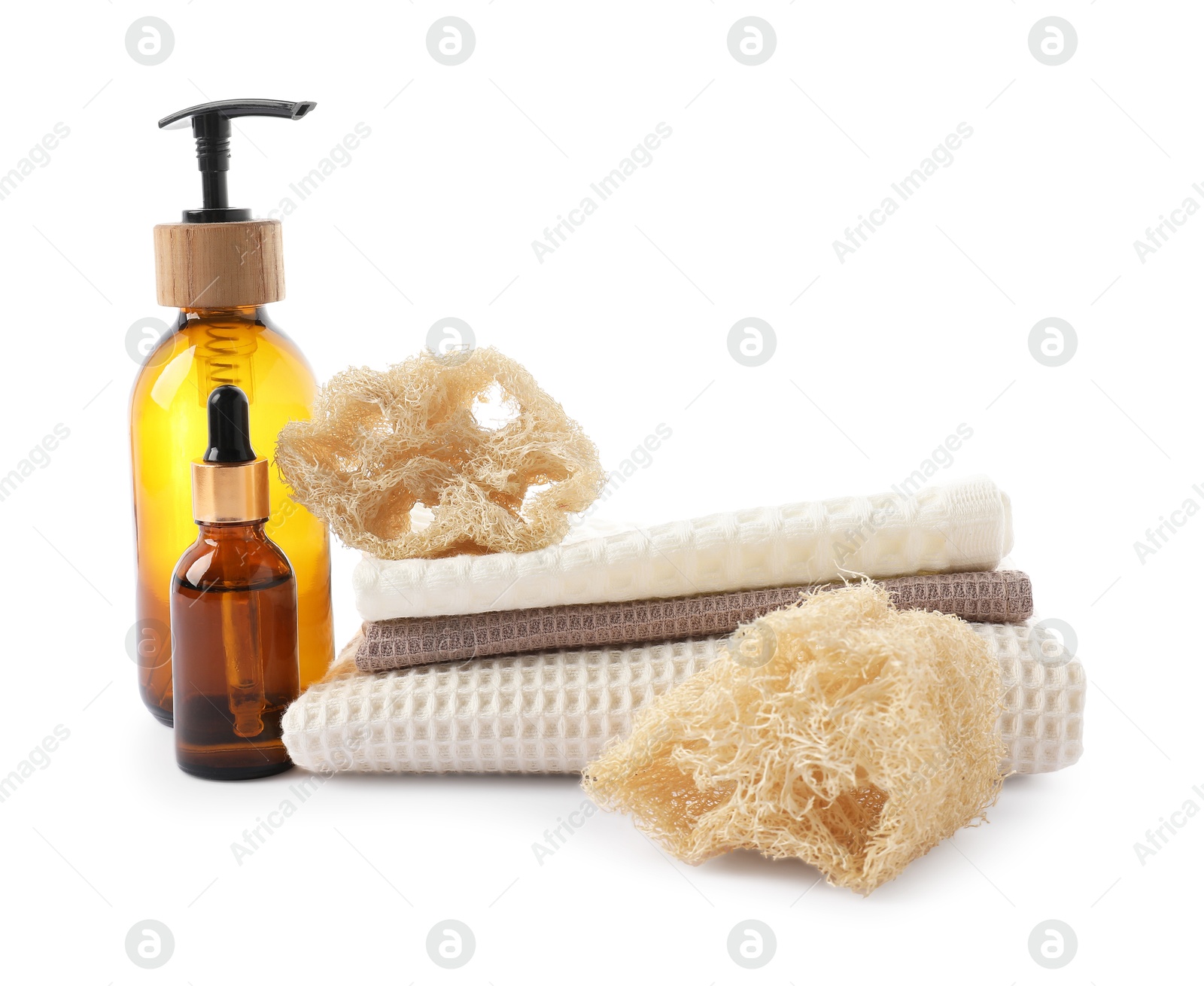 Photo of Spa composition with waffle towels and cosmetic products isolated on white