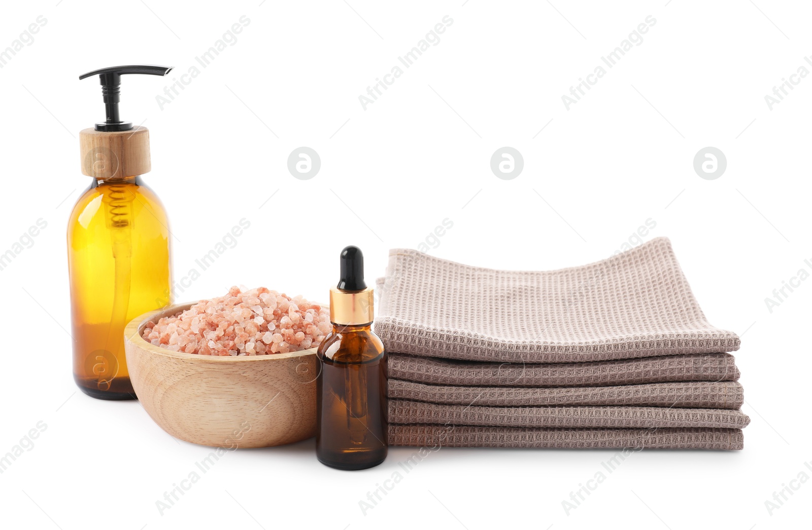 Photo of Spa composition with waffle towels and cosmetic products isolated on white