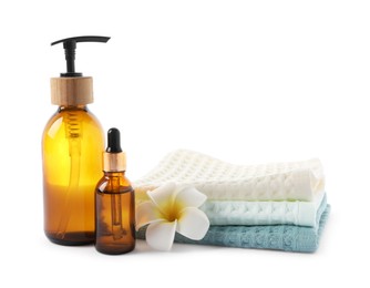 Photo of Spa composition with waffle towels and cosmetic products isolated on white
