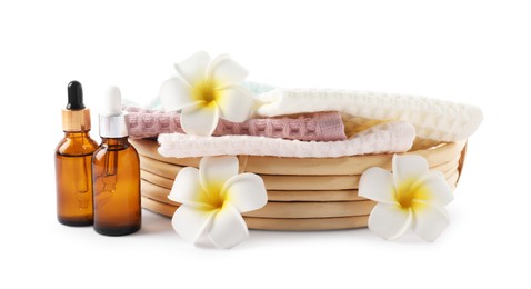 Photo of Spa composition with waffle towels and cosmetic products isolated on white
