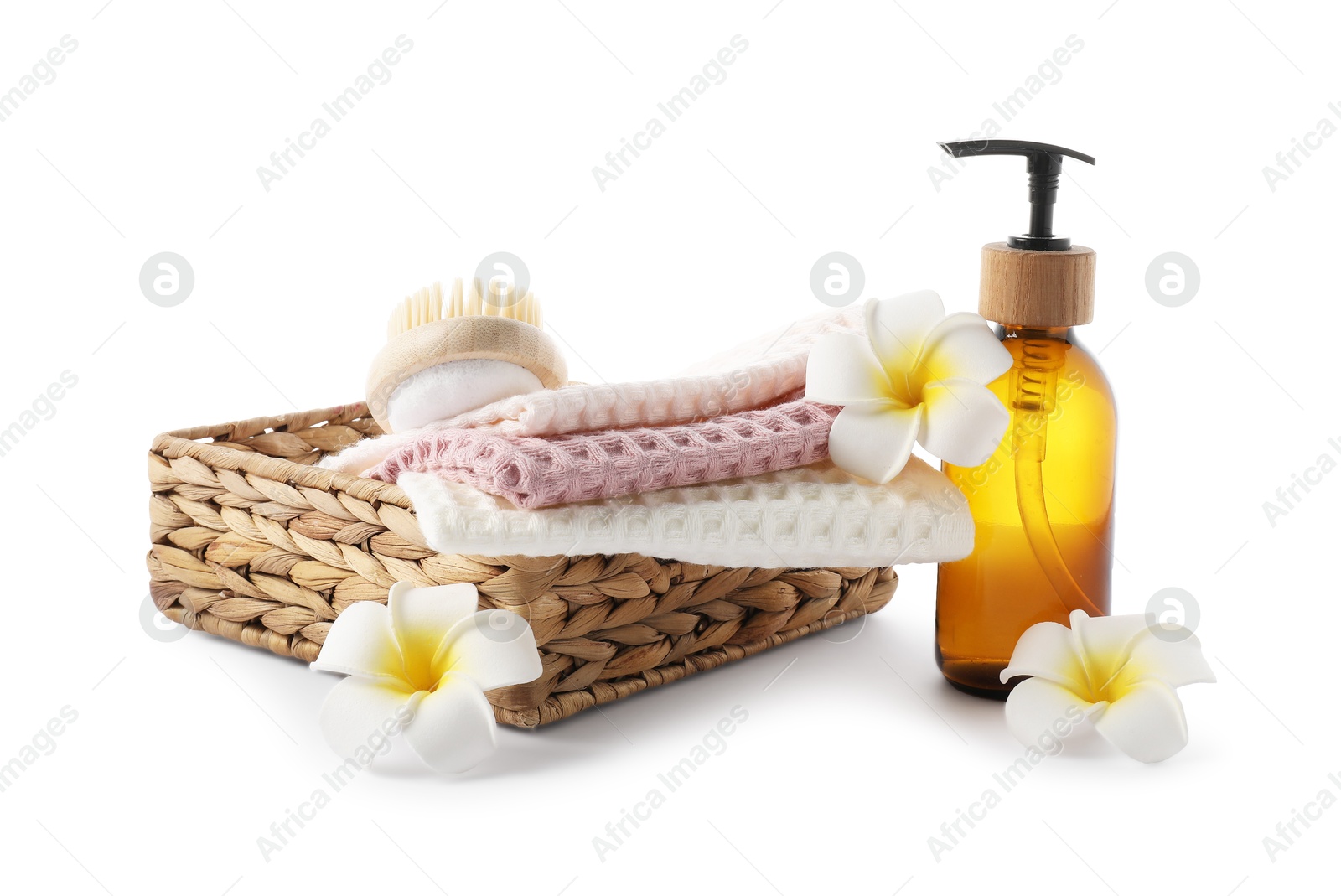 Photo of Spa composition with waffle towels and cosmetic product isolated on white