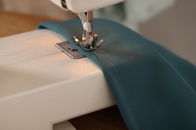 Photo of Closeup view of sewing machine with thread