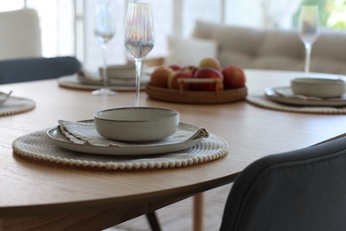 Photo of Beautiful table setting, chairs and decor in dining room, closeup. Interior design