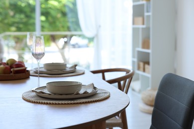 Photo of Beautiful table setting, chairs and decor in dining room, closeup. Interior design