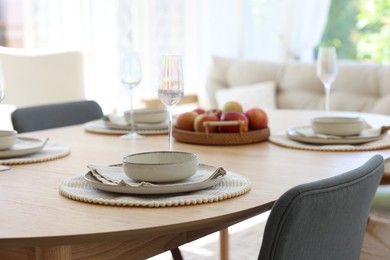 Photo of Beautiful table setting, chairs and decor in dining room, closeup. Interior design