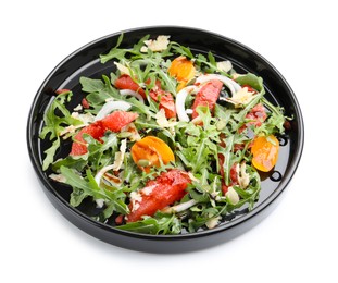 Photo of Tasty salad with arugula, cheese, grapefruit, vegetable and balsamic sauce isolated on white