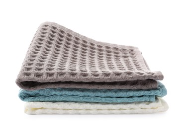 Photo of Clean colorful waffle towels isolated on white