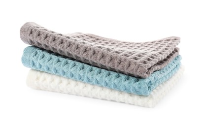 Photo of Clean colorful waffle towels isolated on white