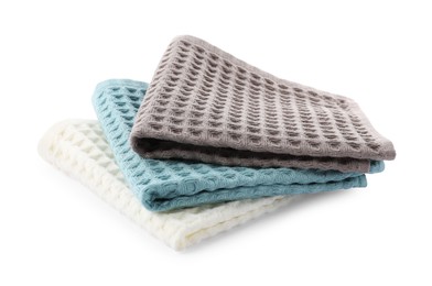 Photo of Clean colorful waffle towels isolated on white