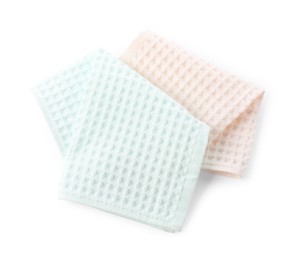 Photo of Clean colorful waffle towels isolated on white, top view