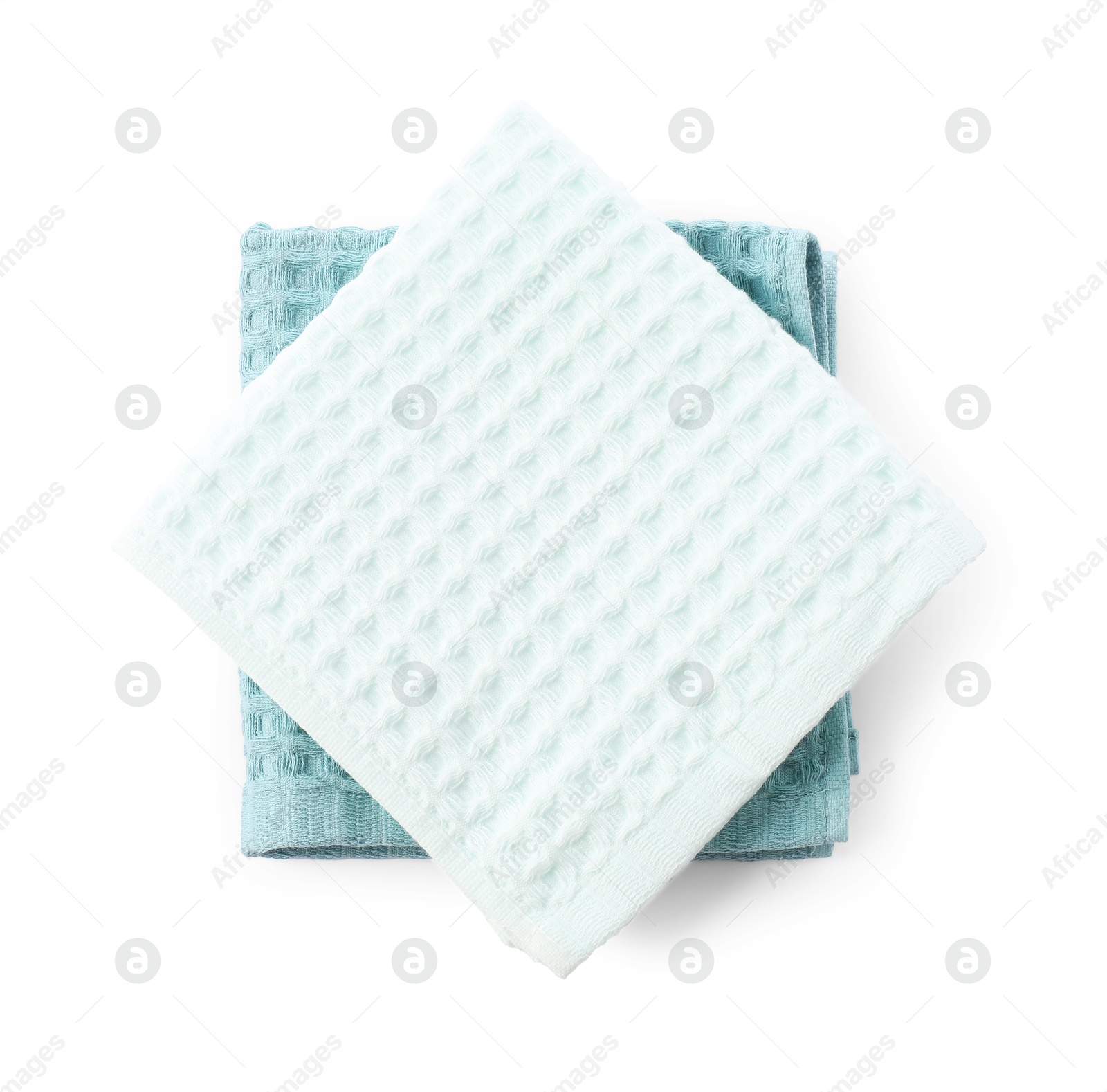 Photo of Clean stacked waffle towels isolated on white, top view