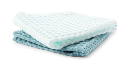 Photo of Clean stacked waffle towels isolated on white