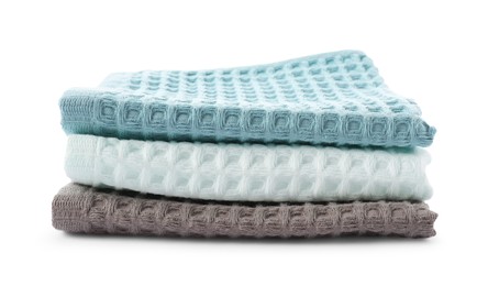 Photo of Clean colorful waffle towels isolated on white