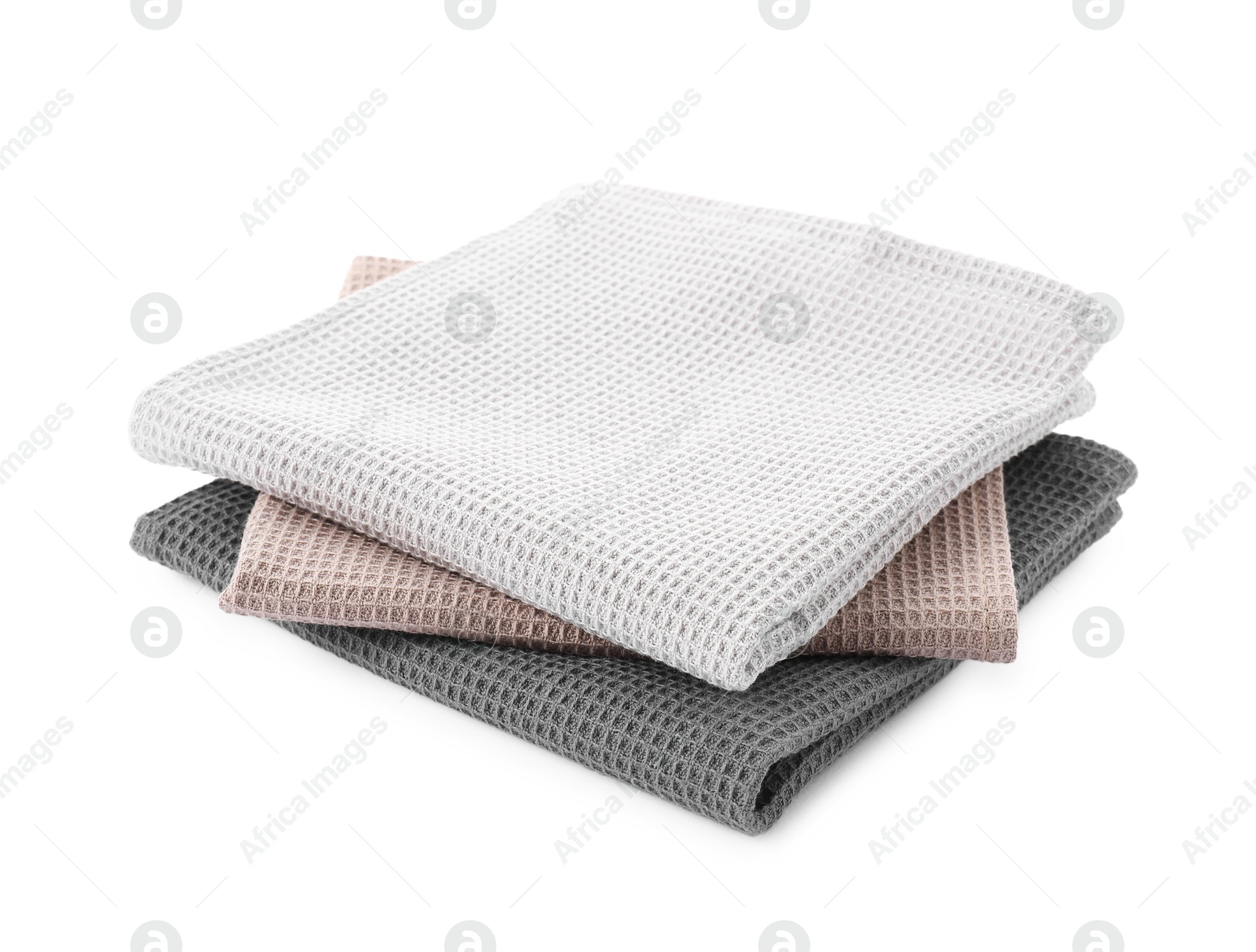 Photo of Clean colorful waffle towels isolated on white