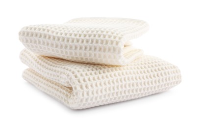 Photo of Clean stacked waffle towels isolated on white