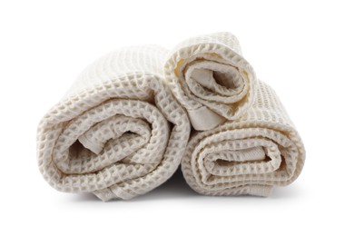 Photo of Clean rolled waffle towels isolated on white