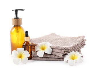 Photo of Spa composition with waffle towels and cosmetic products isolated on white