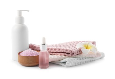 Photo of Spa composition with waffle towels and cosmetic products isolated on white