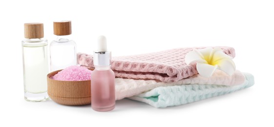 Photo of Spa composition with waffle towels and cosmetic products isolated on white