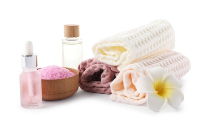 Photo of Spa composition with waffle towels and cosmetic products isolated on white