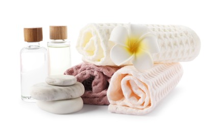 Photo of Spa composition with waffle towels and cosmetic products isolated on white