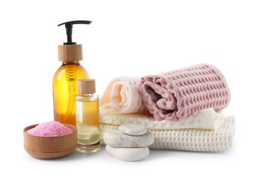 Photo of Spa composition with waffle towels and cosmetic products isolated on white
