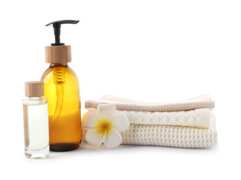 Photo of Spa composition with waffle towels and cosmetic products isolated on white